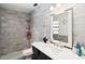 Stylish bathroom with wood-look tile shower, quartz countertop, and modern fixtures at 132 Margate Mews, Longwood, FL 32779