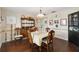 Charming dining room with wood furnishings and décor, creating a warm and inviting space for meals at 132 Margate Mews, Longwood, FL 32779