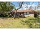 Traditional brick home with a manicured lawn and mature trees at 132 Margate Mews, Longwood, FL 32779