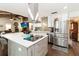 Bright kitchen with stainless steel appliances, a large island and an open concept design at 132 Margate Mews, Longwood, FL 32779