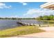 Beautiful lake view featuring a private dock and gazebo, accessible from the property's backyard at 132 Margate Mews, Longwood, FL 32779