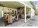 Covered patio with outdoor kitchen, bar, and dining area, great for entertaining at 132 Margate Mews, Longwood, FL 32779