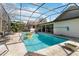Gorgeous swimming pool with a screened-in patio and lush green backyard at 132 Margate Mews, Longwood, FL 32779
