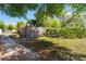 Grassy side yard offering ample space, privacy fence, and mature greenery at 132 Margate Mews, Longwood, FL 32779