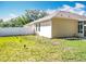 Side view of home, highlighting the fenced yard, basketball hoop, landscaping and screened in patio at 2376 Home Again Rd, Apopka, FL 32712