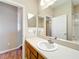 This bathroom features a single sink vanity, and a framed mirror at 2376 Home Again Rd, Apopka, FL 32712