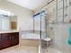 Beautiful bathroom showcasing a walk-in shower and luxurious soaking tub at 2376 Home Again Rd, Apopka, FL 32712