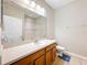This bathroom has a vanity with drawers, toilet and shower with tile surround at 2376 Home Again Rd, Apopka, FL 32712