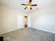 This bedroom features a ceiling fan, carpet and closet at 2376 Home Again Rd, Apopka, FL 32712