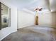 Lovely bedroom with ceiling fan, tray ceiling, and lots of natural light at 2376 Home Again Rd, Apopka, FL 32712
