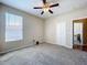 This unfurnished bedroom includes a large window and closet at 2376 Home Again Rd, Apopka, FL 32712