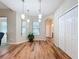 Dining area with pendant lighting, wood floors, and bright windows overlooking the outdoors at 2376 Home Again Rd, Apopka, FL 32712