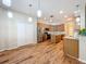 Kitchen with wood-look floors, stainless appliances, and an island for food preparation at 2376 Home Again Rd, Apopka, FL 32712