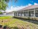 Enclosed sunroom, offering an abundance of natural light and relaxing backyard views at 2376 Home Again Rd, Apopka, FL 32712