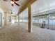 Bright sunroom with ceiling fans, neutral carpet, and tons of natural light at 2376 Home Again Rd, Apopka, FL 32712