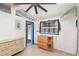 Bright bedroom featuring coastal decor, a window with netting, and a ceiling fan enhancing its nautical charm at 370 Hartford Ave, Daytona Beach, FL 32118