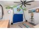Nautical-themed room featuring palm tree decor, seaside paintings, and a ceiling fan, capturing a coastal atmosphere at 370 Hartford Ave, Daytona Beach, FL 32118