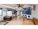 Open-concept kitchen with nautical decor, turtle accents, and a breakfast bar, blending functionality with coastal charm at 370 Hartford Ave, Daytona Beach, FL 32118