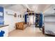 Bright living room with a ceiling fan, tiled floor, wooden furniture, and beach-themed decorations at 370 Hartford Ave, Daytona Beach, FL 32118