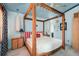 Canopy bed is the highlight of this blue and bright main bedroom at 370 Hartford Ave, Daytona Beach, FL 32118