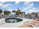 Outdoor pool surrounded by white wooden deck and tropical palm trees creating a resort-like backyard at 370 Hartford Ave, Daytona Beach, FL 32118