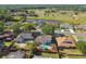 An aerial view showcases a neighborhood with ponds, green spaces, and well-kept homes at 4133 Staffordshire Dr, Lakeland, FL 33809