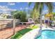 The backyard has a storage shed, hammock, and lush landscaping for a private retreat at 4133 Staffordshire Dr, Lakeland, FL 33809
