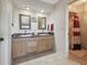 Bathroom featuring double sinks, granite countertops, and a shower and tub combo at 4133 Staffordshire Dr, Lakeland, FL 33809