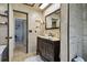Elegant bathroom featuring a vanity, a framed mirror, and attractive tile work at 4133 Staffordshire Dr, Lakeland, FL 33809