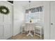 Cozy breakfast nook featuring decorative window treatment and modern lighting fixture at 4133 Staffordshire Dr, Lakeland, FL 33809