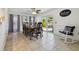 Formal dining room with elegant wood table, backyard views, and a cozy rocking chair, perfect for entertaining at 4133 Staffordshire Dr, Lakeland, FL 33809