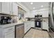A bright kitchen featuring stainless steel appliances, light countertops, and convenient layout for meal preparation at 4133 Staffordshire Dr, Lakeland, FL 33809