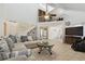 Open-concept living room with soaring ceilings, a cozy sectional, and seamless flow to other areas of the home at 4133 Staffordshire Dr, Lakeland, FL 33809