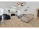 Bright living room with a brick fireplace, vaulted ceiling, and comfortable seating, providing a welcoming atmosphere at 4133 Staffordshire Dr, Lakeland, FL 33809