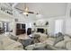 Spacious living room featuring a brick fireplace, comfortable seating, and bright windows for a relaxing ambiance at 4133 Staffordshire Dr, Lakeland, FL 33809