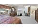 Spacious main bedroom featuring decorative furniture, vaulted ceilings, and an office nook at 4133 Staffordshire Dr, Lakeland, FL 33809