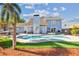 Backyard view of in-ground pool and patio area with lounge chairs and mature landscaping at 4133 Staffordshire Dr, Lakeland, FL 33809