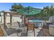 Backyard with above-ground pool, shade umbrella, outdoor seating, and privacy fence at 4719 Dove Cross Dr, Lakeland, FL 33810