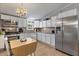 Well-lit kitchen featuring modern appliances, white cabinetry, and a breakfast nook for casual dining at 4719 Dove Cross Dr, Lakeland, FL 33810