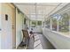 Relaxing screened-in porch with comfortable seating, providing a perfect space for enjoying the outdoors at 4719 Dove Cross Dr, Lakeland, FL 33810