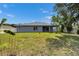 Well-manicured backyard with a covered patio perfect for outdoor gatherings at 5349 Hidden Oaks Dr, Lakeland, FL 33811