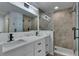 Bathroom displays double vanity, modern fixtures, frameless shower, and neutral tile work at 5349 Hidden Oaks Dr, Lakeland, FL 33811