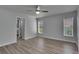 Spacious bedroom features modern ceiling fan, light-colored flooring and bright windows at 5349 Hidden Oaks Dr, Lakeland, FL 33811