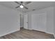 Bedroom featuring wood-look floors, a closet, and a view into another room at 5349 Hidden Oaks Dr, Lakeland, FL 33811