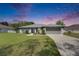 Beautiful single-story home with manicured lawn, two-car garage, and inviting curb appeal at 5349 Hidden Oaks Dr, Lakeland, FL 33811