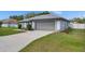 Lovely single-story home featuring a two-car garage and a spacious driveway at 5349 Hidden Oaks Dr, Lakeland, FL 33811