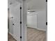 Hallway view of bedroom featuring closet with sliding doors and modern ceiling fan at 5349 Hidden Oaks Dr, Lakeland, FL 33811