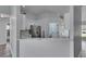 Bright kitchen showcases white cabinets, stainless steel appliances, and breakfast bar seating area at 5349 Hidden Oaks Dr, Lakeland, FL 33811
