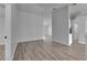 Spacious living room featuring wood-look flooring and an open floor plan, perfect for entertaining at 5349 Hidden Oaks Dr, Lakeland, FL 33811