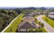 Desirable neighborhood, manicured lawns and mature landscaping surround this well-maintained homesite with mature palms at 10367 Addison Shore Way, Oxford, FL 34484